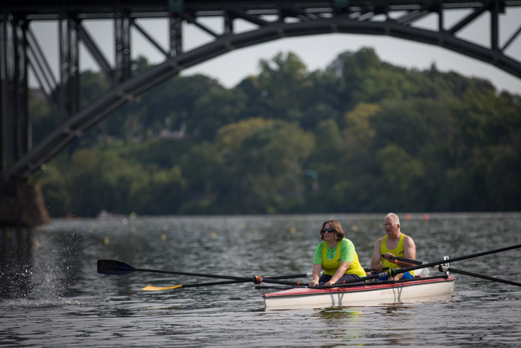 rowers racing under one of the bridges on the river