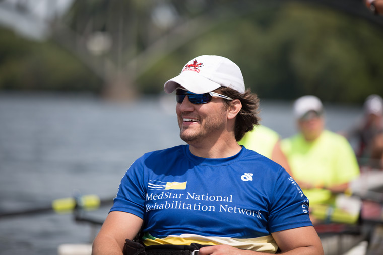 a close-up shot of a smiling rower